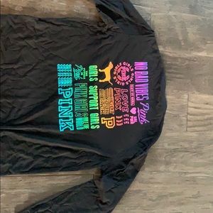 Women’s pink long sleeve shirt.